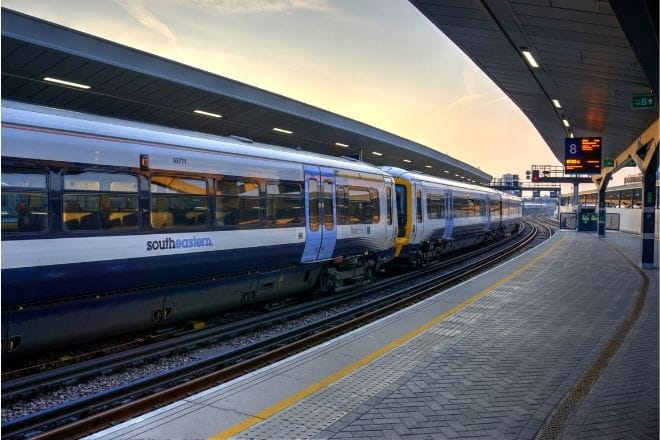 a passenger train pulling into a station