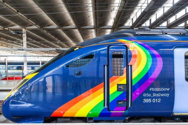 Blue train with rainbow on
