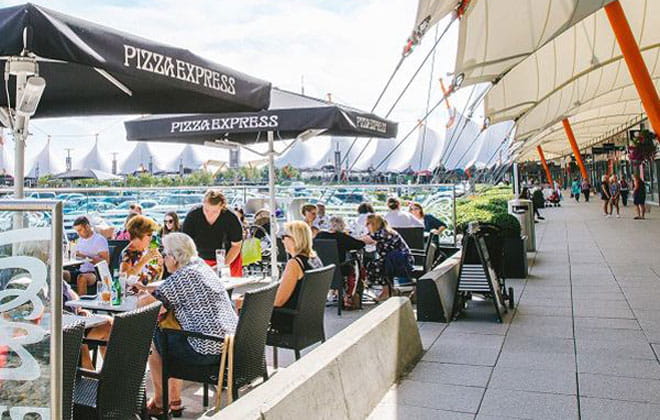 a group of people eating al fresco