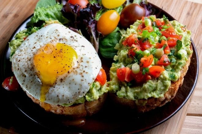 a plate of food on a wooden table