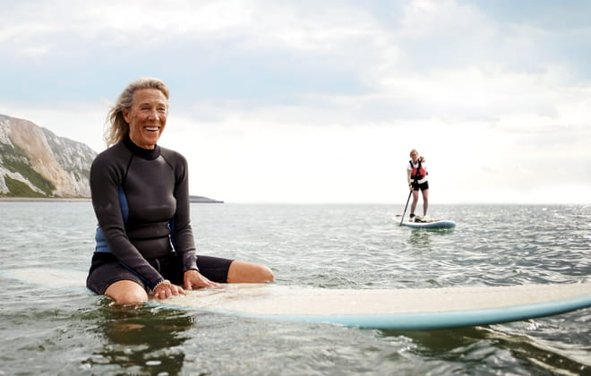 Mature woman on paddle board