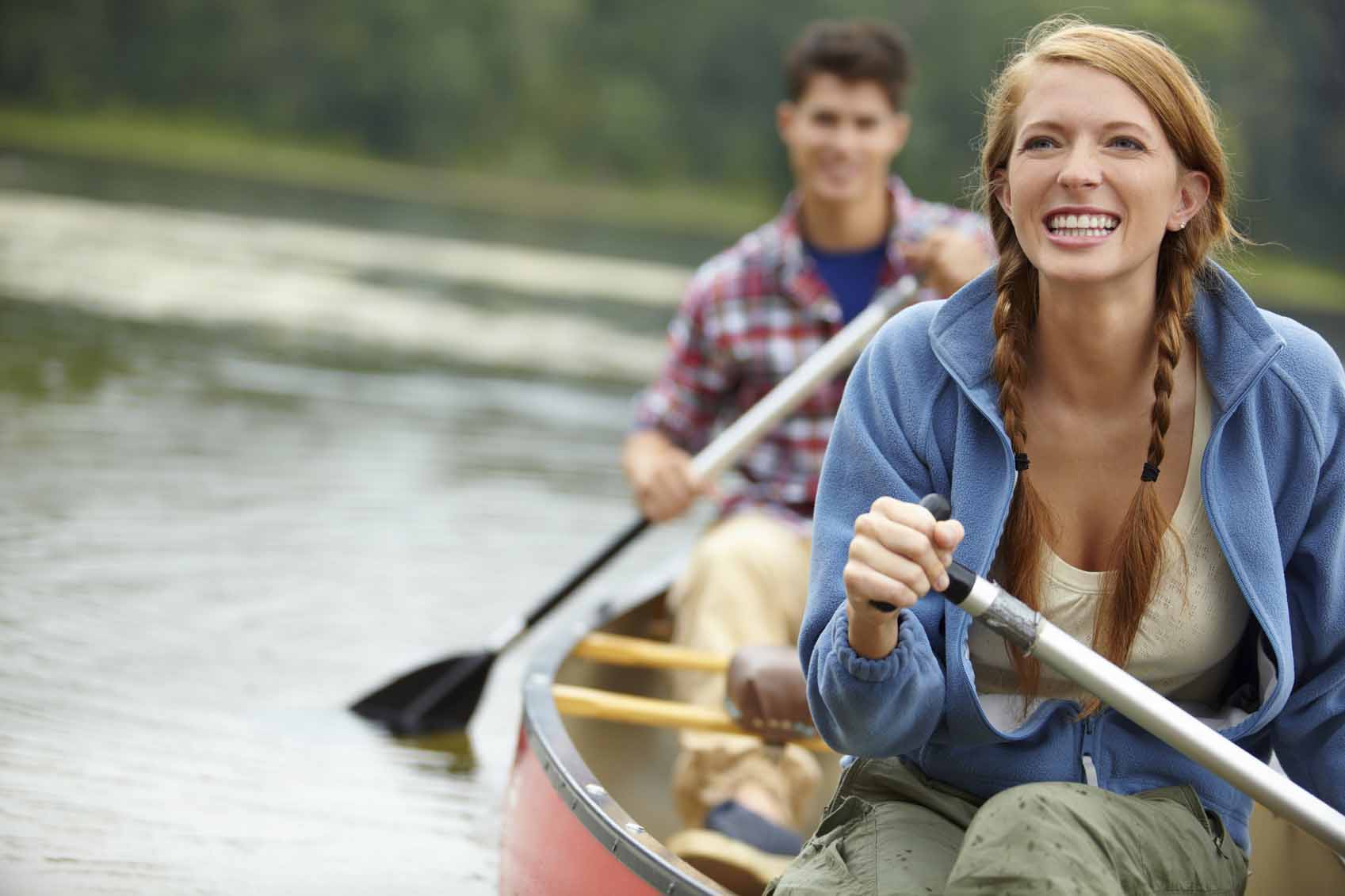 Man and woman canoeing