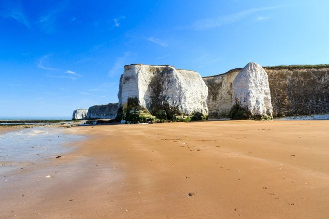 White cliff formation at Botany Bay next to a sandy beach