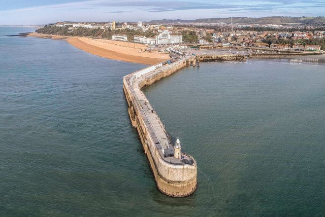 Folkestone Harbour Arm with Sunny Sands in the background