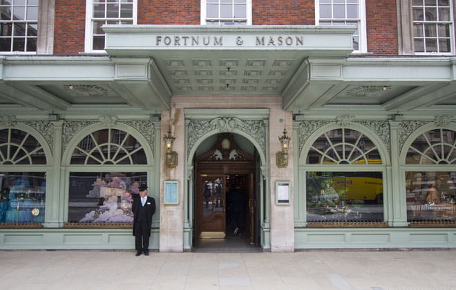 The front of Fortnum and Mason shop with doorman 