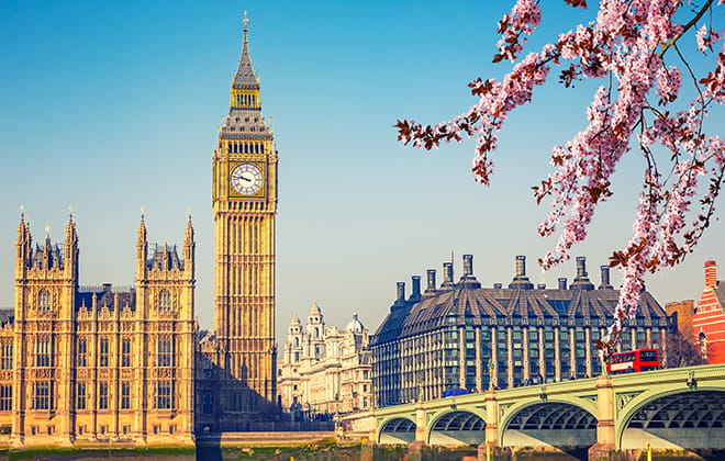 a large clock tower towering over the city of london