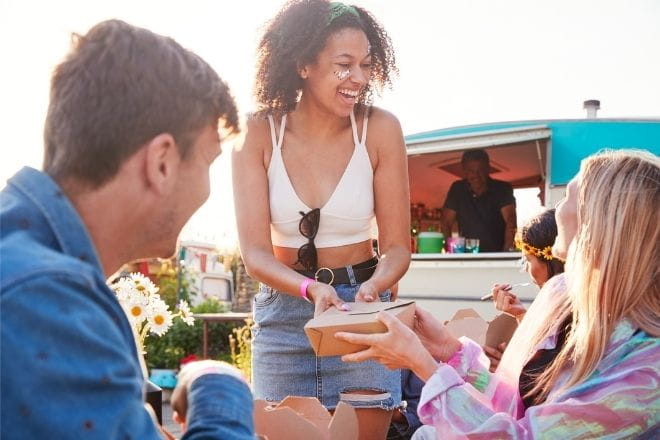 people laughing at a festival