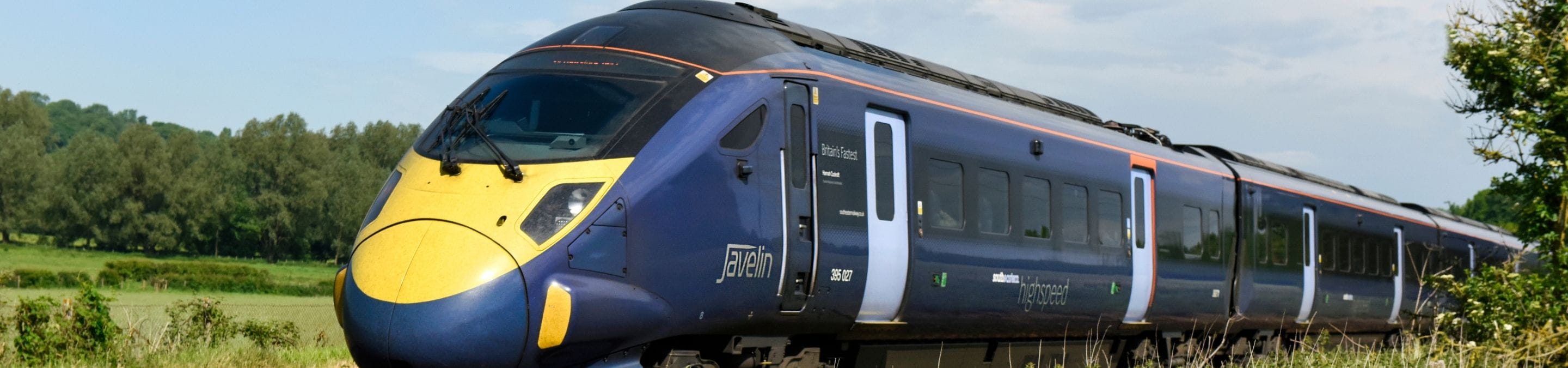 a high speed train going through the countryside