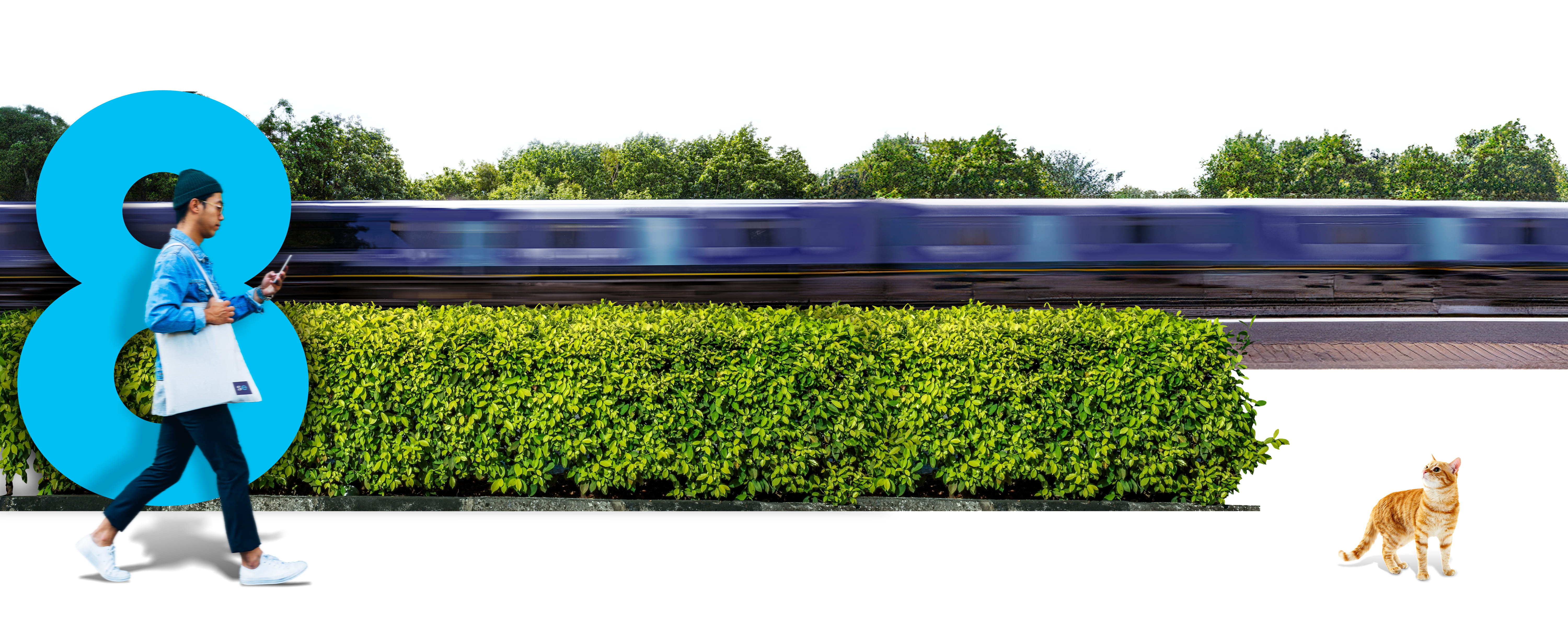 man stood in front of a blue 8 figure with a train whizzing past in the background