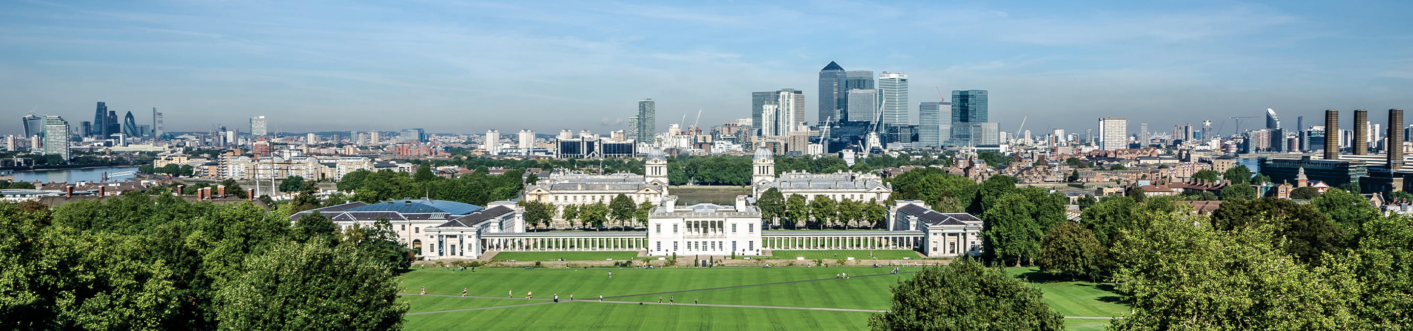 National Maritime Museum in Greenwich with London skyline in the background