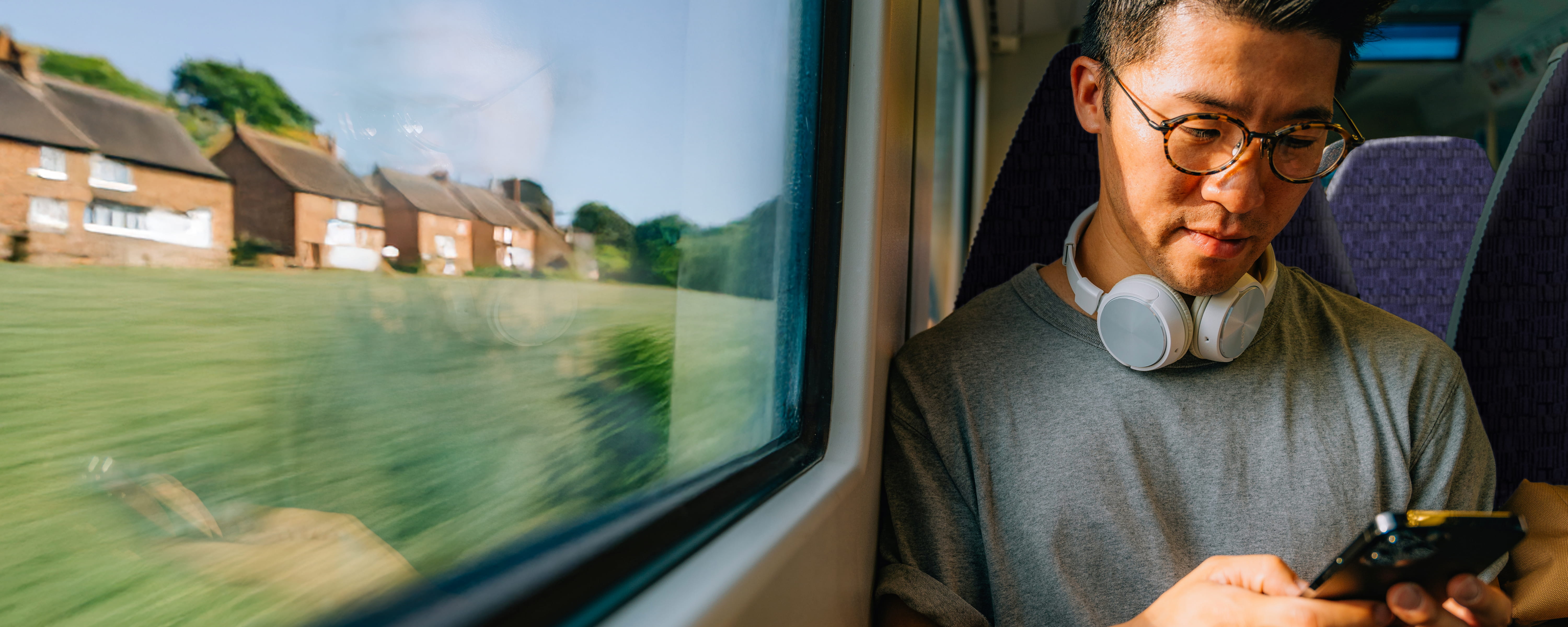 a man on a train using his phone