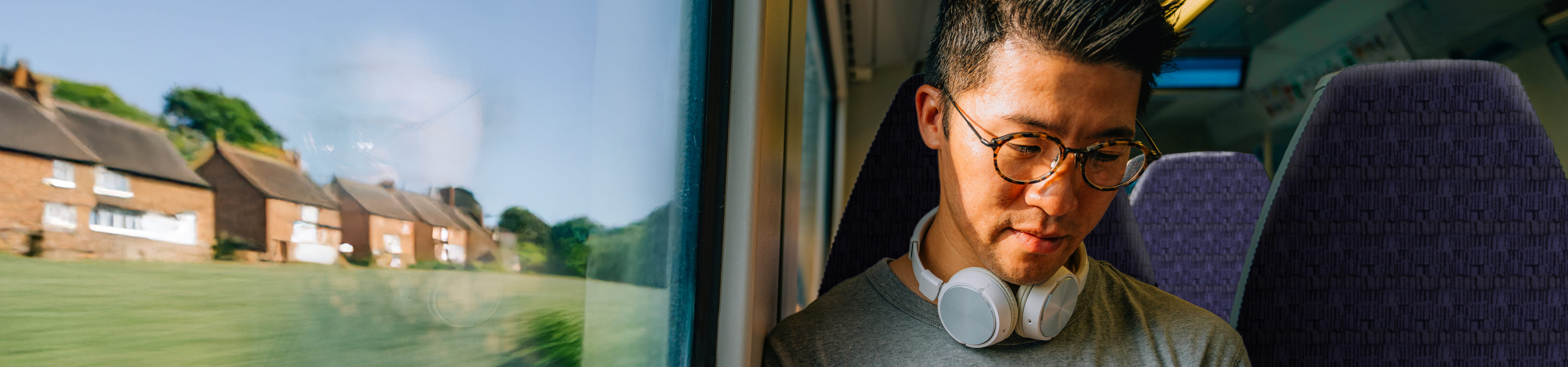 a man on a train using his phone