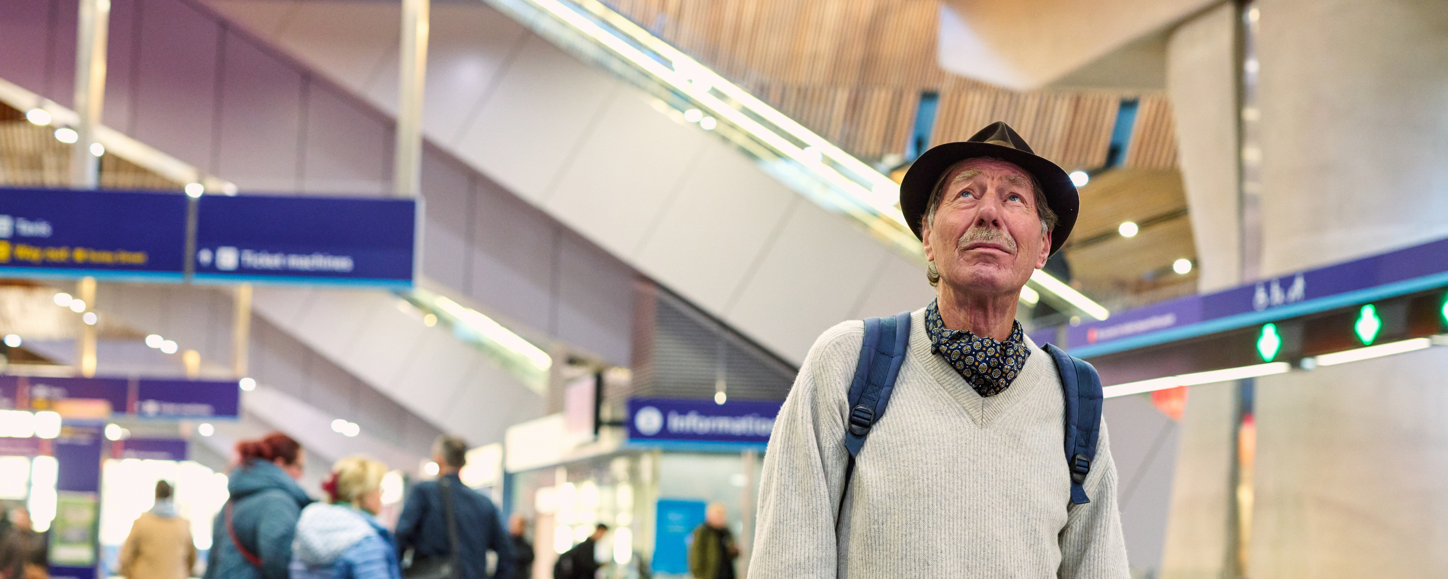 A retired man walks through London Bridge station