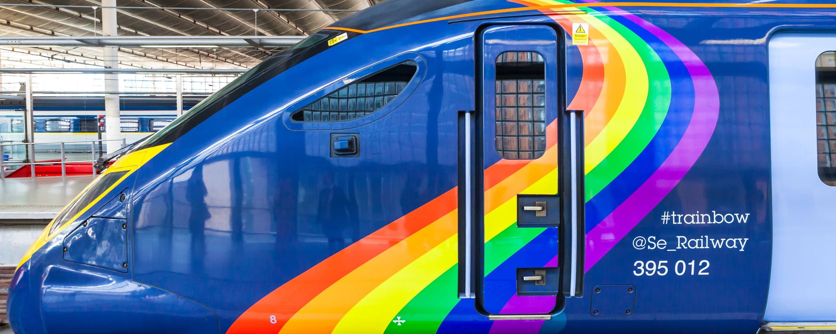 Blue train with rainbow painted on