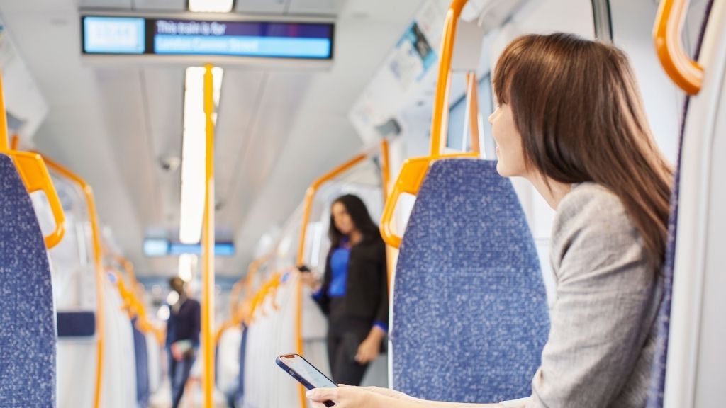 a woman sitting on a train