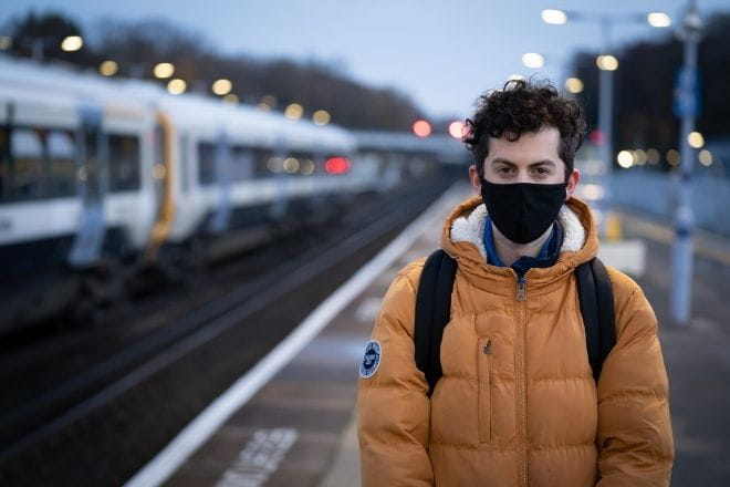 a person standing in a train station