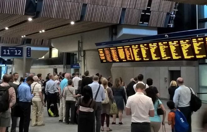 a group of people standing in front of a crowd