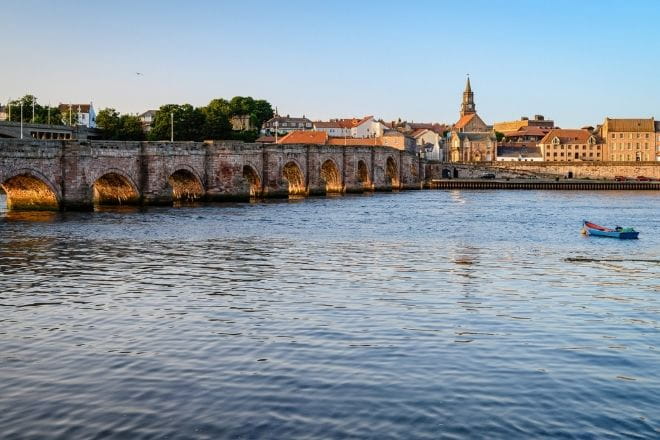 a bridge over the river Tweed with Berwick in the background