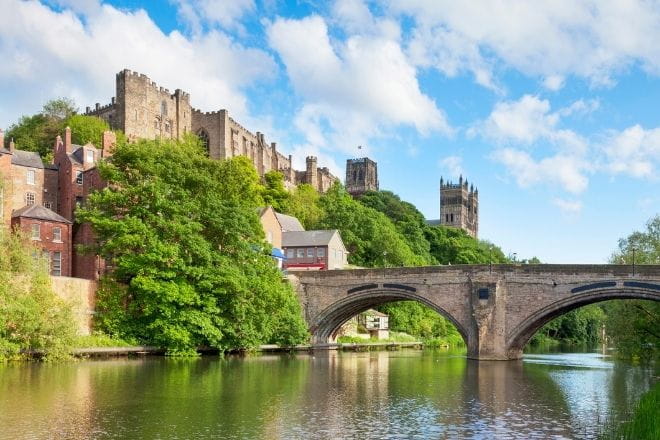 Durham castle and cathedral on the rock above the city and Framwellgate bridge