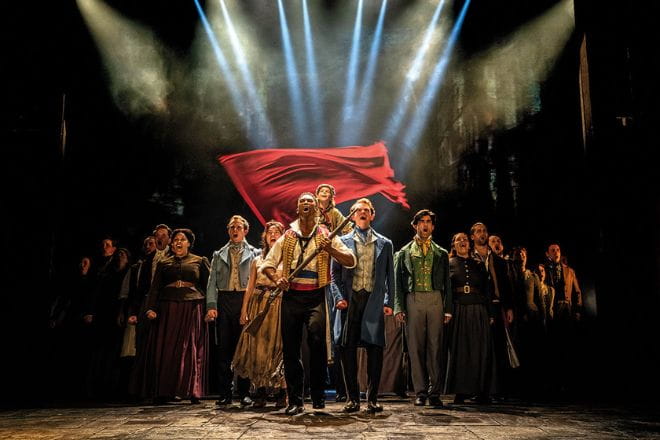 Cast of Les Miserables on stage
