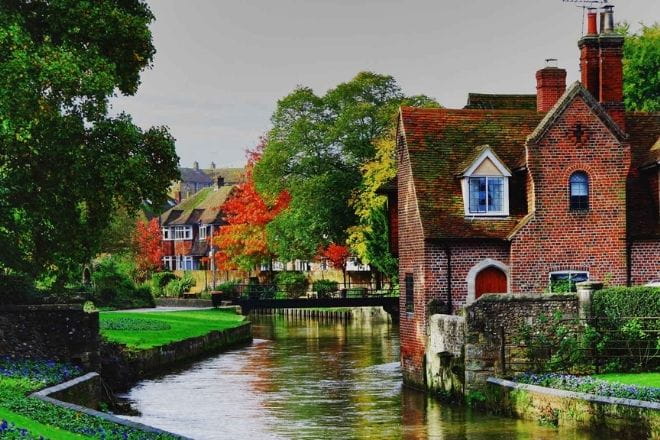 a small house surrounded by water