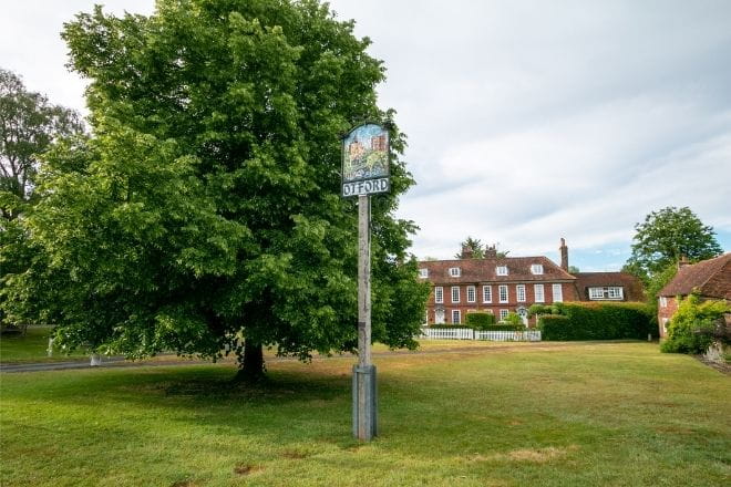 a tree in front of a house