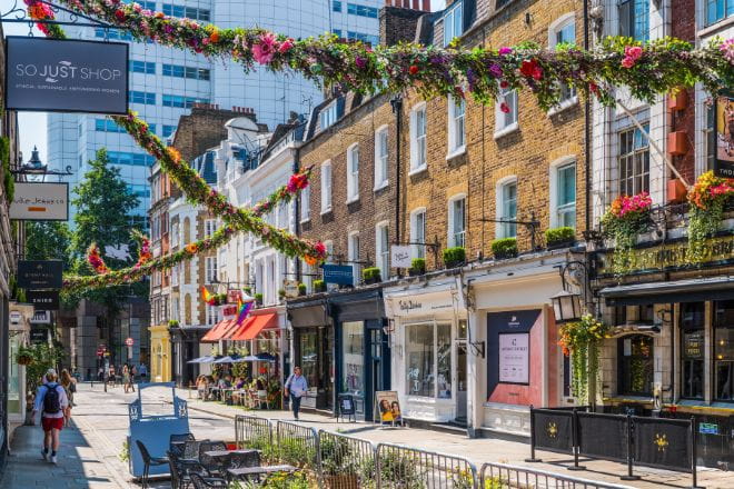 a street in Covent Garden lined with shops and restaurants