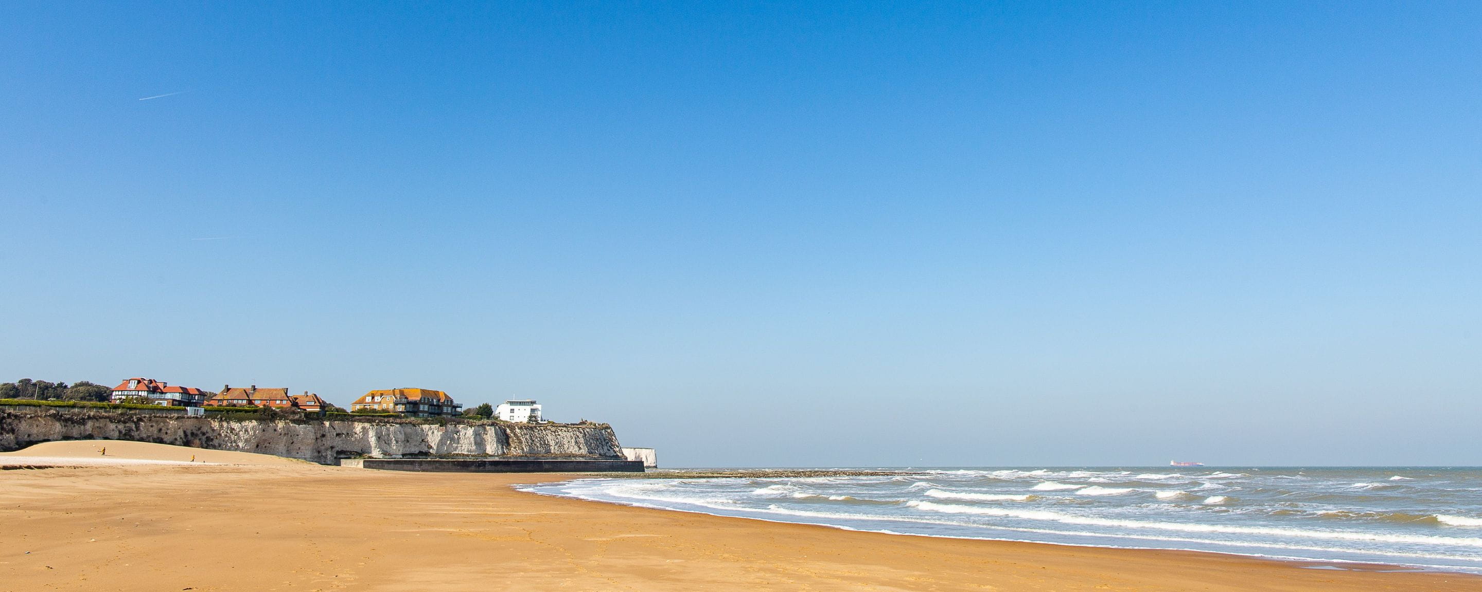 beach in Broadstairs with golden sand and blue sky