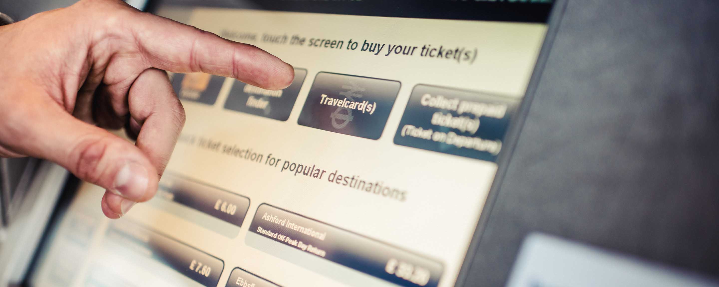 Hand tapping on a ticket screen